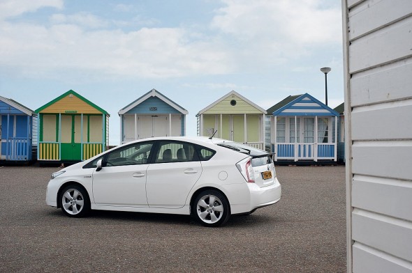 White Prius rear plate change beach hut