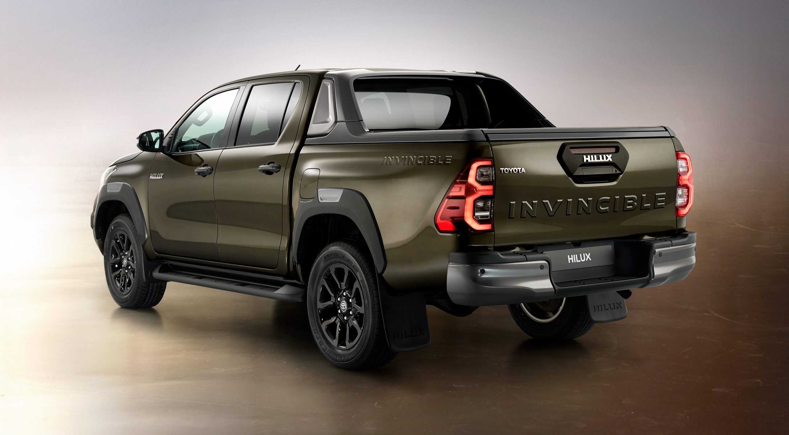 2021 Toyota Hilux Invincible in Titan Bronze - rear three-quarter