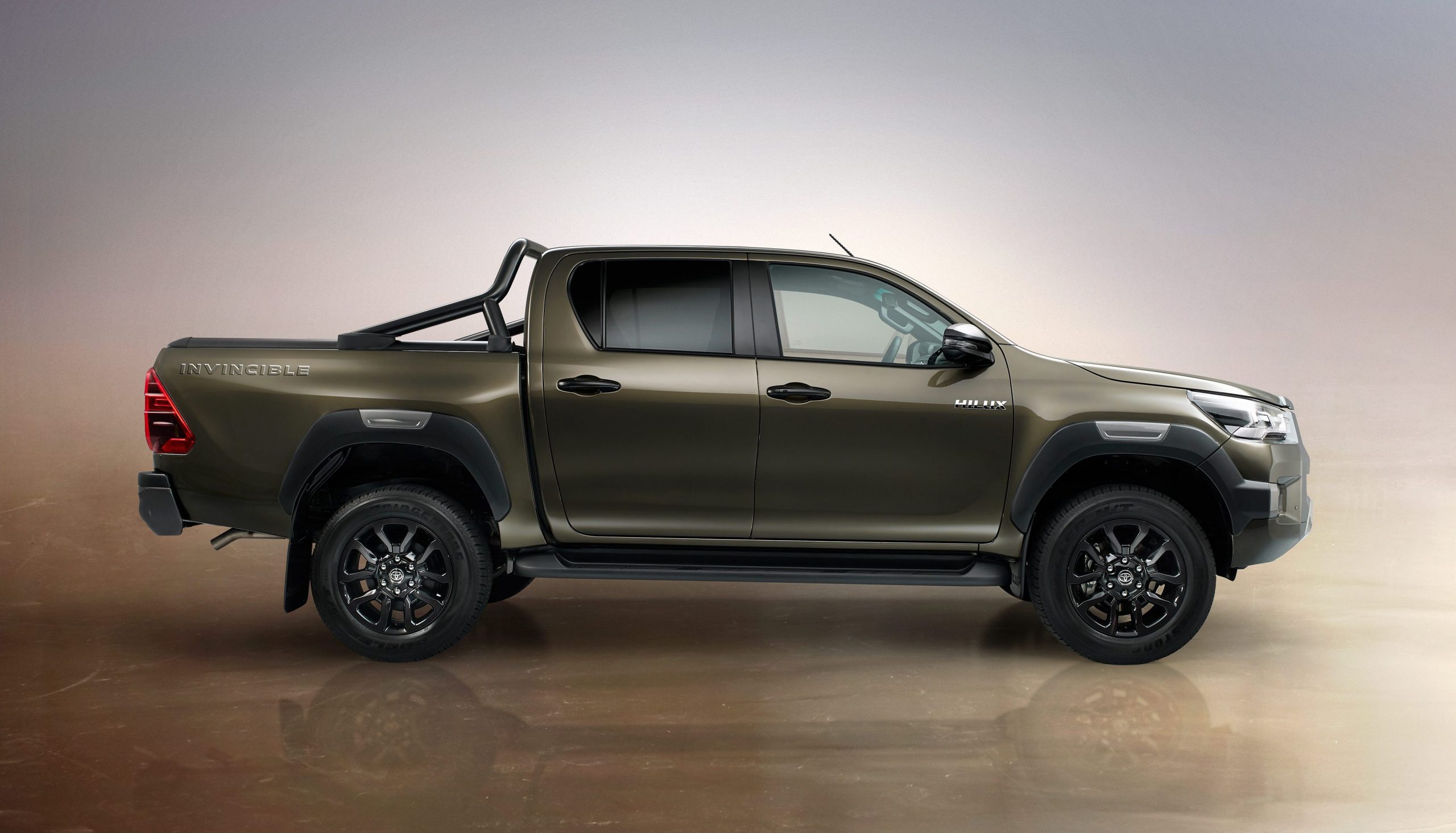 2021 Toyota Hilux Invincible in Titan Bronze - side profile view