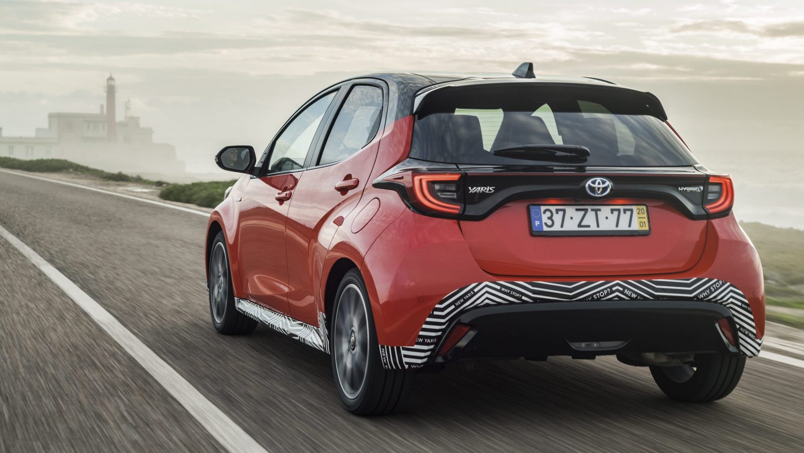 Rear view of prototype Toyota Yaris driving on the road