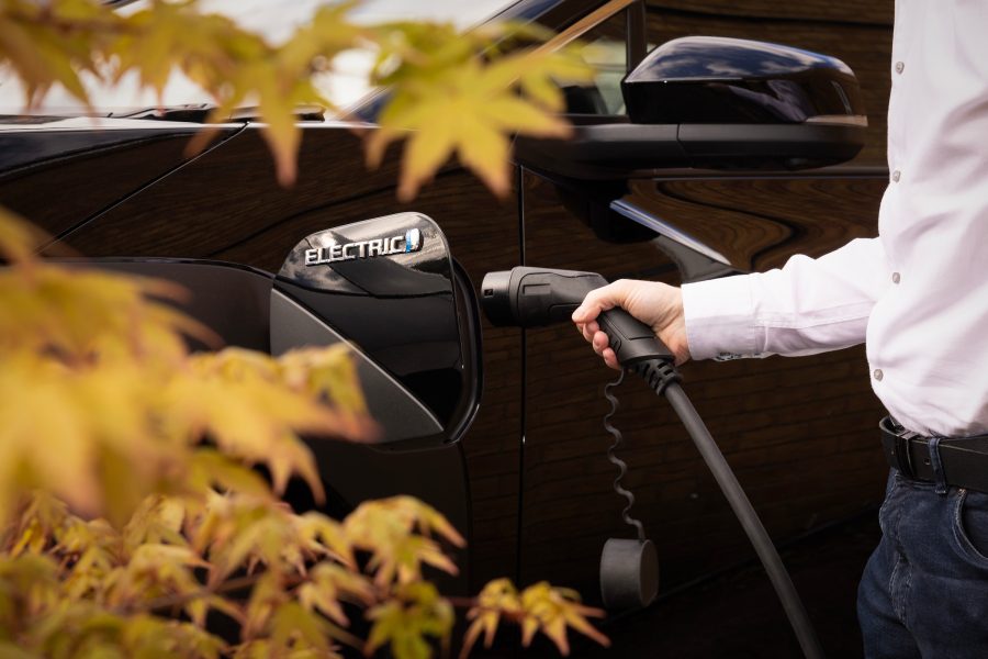 Toyota bZ4X charger being plugged in