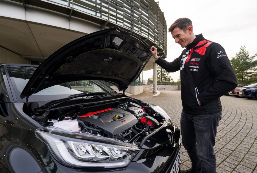 Elfyn Evans admires the engine bay of his new Toyota GR Yaris