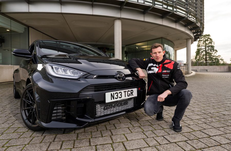 Elfyn Evans in front of his new Toyota GR Yaris outside Toyota GB's headquarters