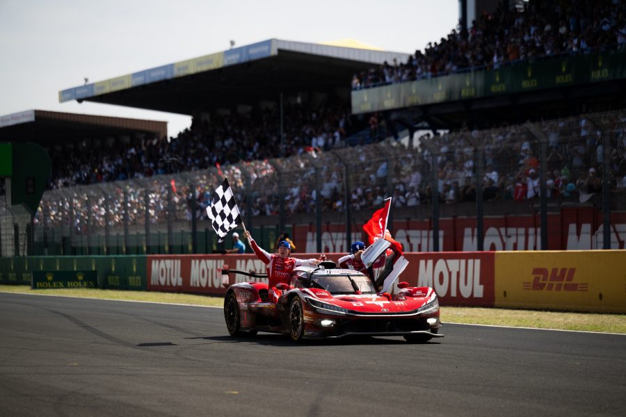 Toyota No.7 TR010 Hybrid wins the 2026 Le Mans 24 Hours with drivers celebrating at the finish.