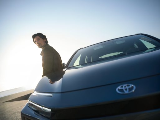 Owner leading on door of Toyota C-HR+